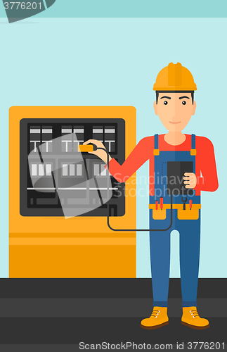 Image of Electrician with electrical equipment.