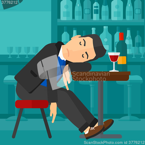 Image of Man sleeping in bar. 