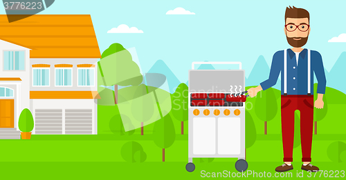 Image of Man preparing barbecue.