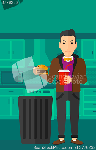 Image of Man throwing junk food.
