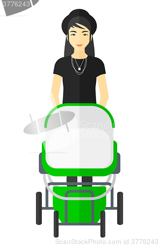 Image of Woman pushing pram.