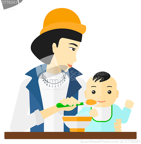 Image of Woman feeding baby.