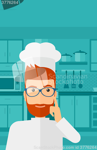 Image of Chef pointing forefinger up.