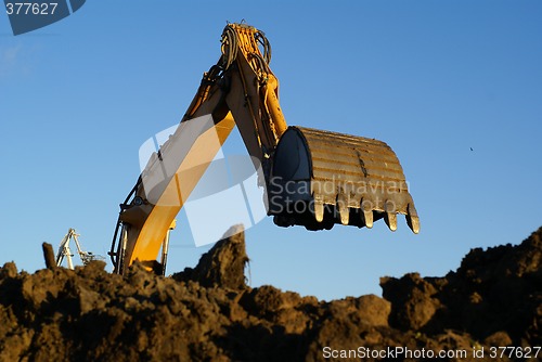 Image of Shovel bucket against blue sky