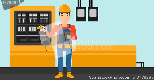 Image of Electrician with electrical equipment.