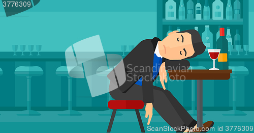 Image of Man sleeping in bar. 