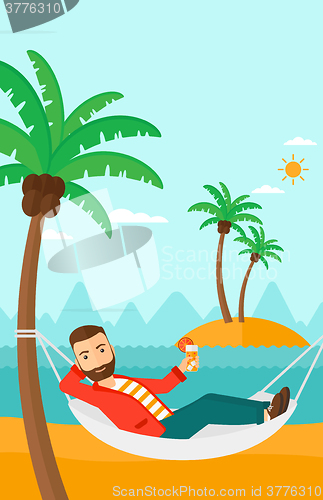 Image of Man chilling in hammock.