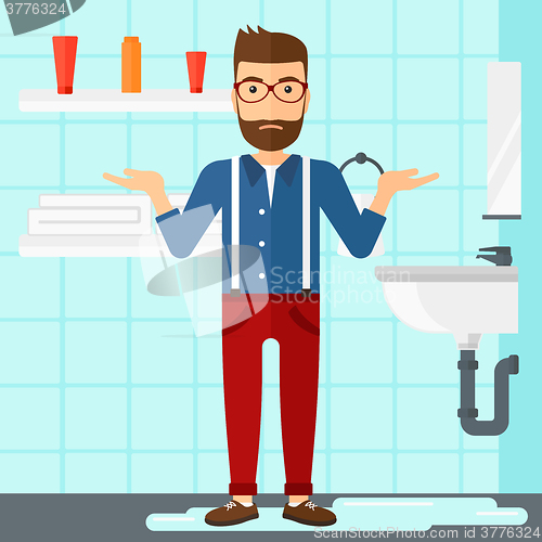 Image of Man in despair standing near leaking sink.