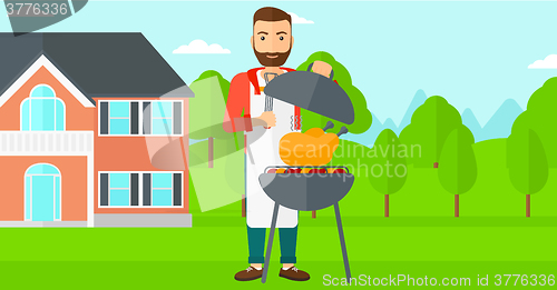 Image of Man preparing barbecue.