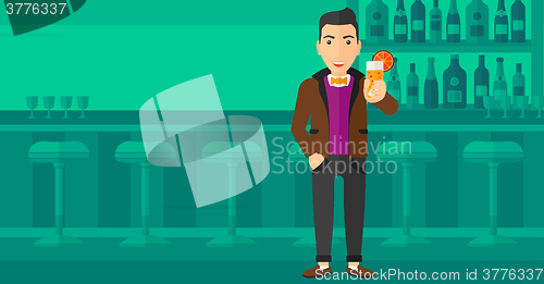 Image of Man holding glass of juice.