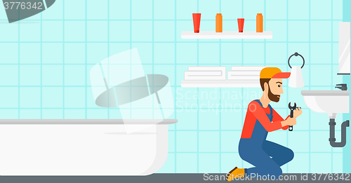 Image of Woman repairing sink.