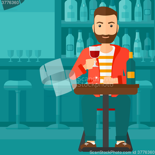 Image of Man sitting at bar.