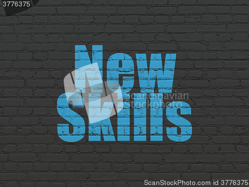 Image of Learning concept: New Skills on wall background