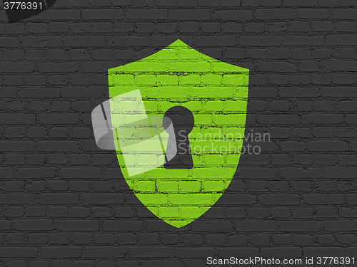 Image of Safety concept: Shield With Keyhole on wall background