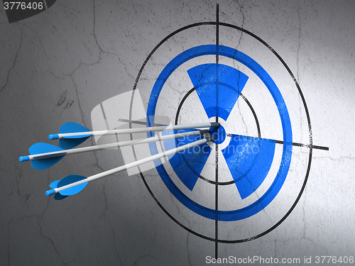 Image of Science concept: arrows in Radiation target on wall background