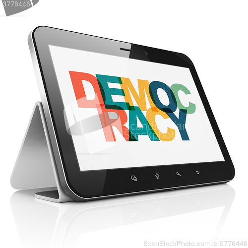 Image of Political concept: Tablet Computer with Democracy on  display