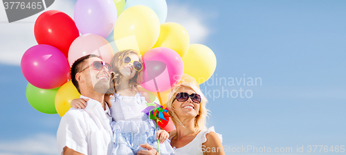 Image of family with colorful balloons