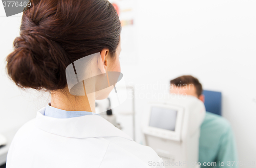 Image of close up of optician and patient at eye clinic