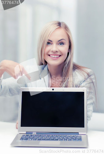 Image of businesswoman with laptop computer