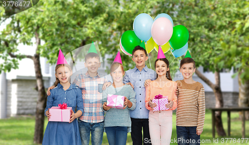 Image of happy children with gifts on birthday party