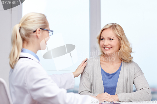 Image of doctor talking to woman patient at hospital