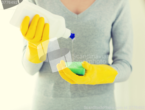 Image of close up of woman with sponge and cleanser