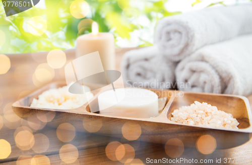 Image of close up of soap, himalayan salt and scrub in bowl