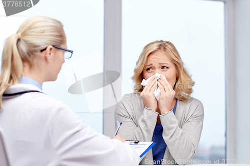 Image of doctor and ill woman patient with flu at clinic