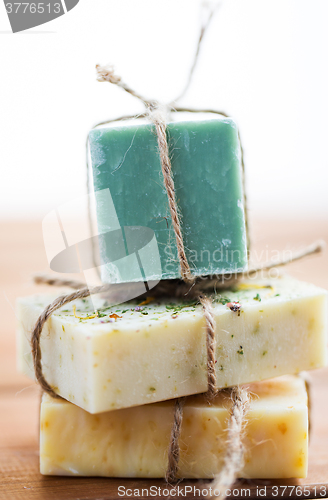 Image of close up of handmade soap bars on wood