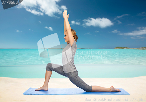 Image of happy woman making yoga in low lunge on mat