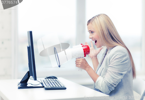 Image of strict businesswoman shouting in megaphone