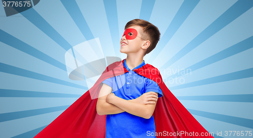 Image of boy in red super hero cape and mask