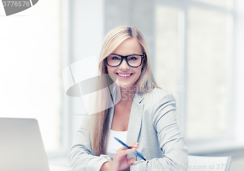 Image of businesswoman with pen