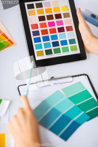 Image of woman working with color samples for selection