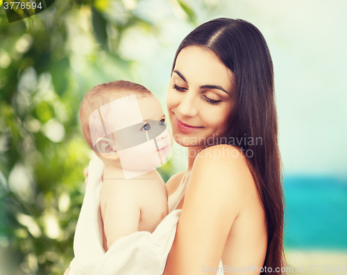 Image of happy mother with adorable baby