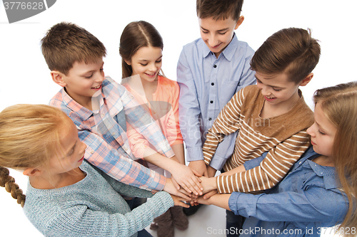 Image of happy children with hands on top