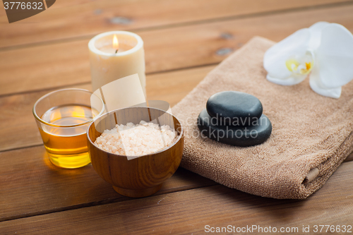 Image of close up of pink salt with honey and bath stuff