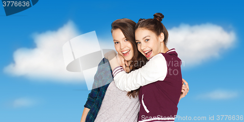 Image of happy smiling pretty teenage girls hugging