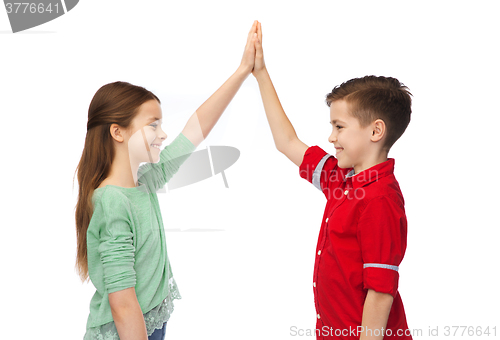 Image of happy boy and girl making high five