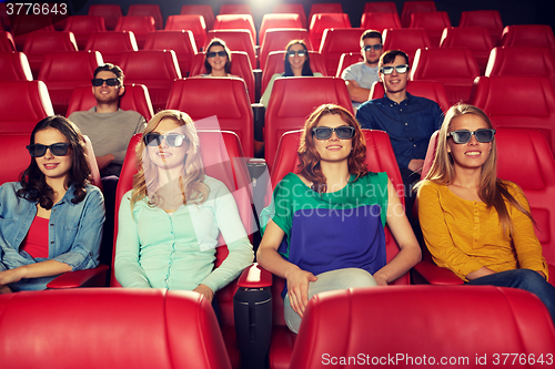 Image of happy friends watching movie in 3d theater