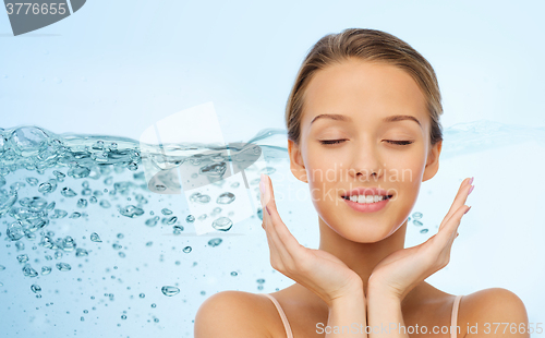 Image of smiling young woman face and hands
