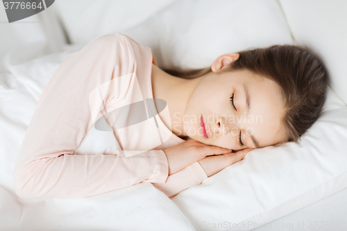 Image of girl sleeping in bed at home