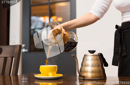 Image of close up of barista woman making coffee