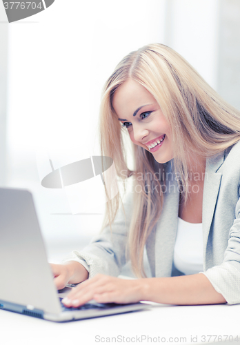 Image of businesswoman with laptop