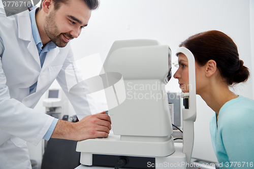 Image of optician with tonometer and patient at eye clinic