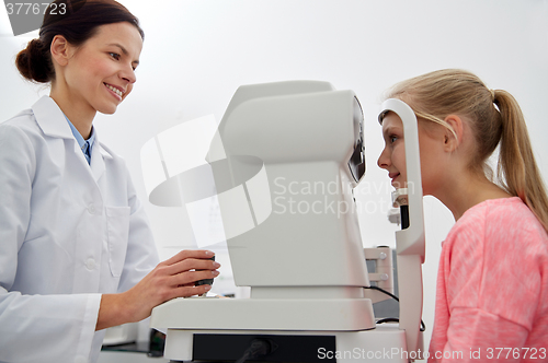 Image of optician with tonometer and patient at eye clinic