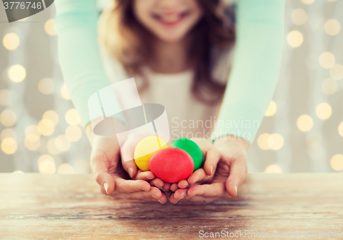 Image of close up of happy family holding easter eggs