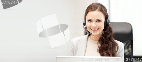 Image of helpline operator with laptop computer