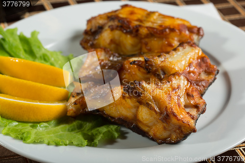 Image of fried catfish. delicious fatty fish on a plate