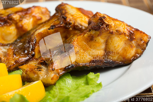 Image of fried catfish. delicious fatty fish on a plate